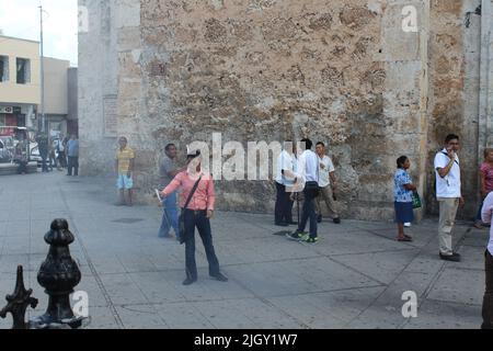 MERIDA, MEXICO - OCTOBER 1, 2016 Los Gremios - Catedral de San Ildefonso - Plaza Grande - man lighting fireworks Stock Photo