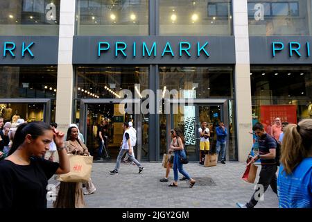 Brussels, Belgium. 13th July, 2022. People walk down in commercial ...