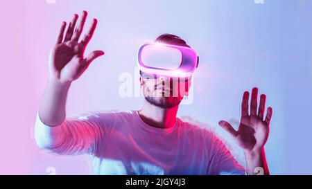 Modern digital entertainment. Man uses virtual glasses Stock Photo