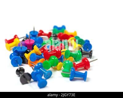 Colorful pushpins against a white background Stock Photo