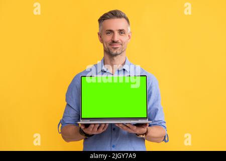 smiling businessman presenting product. presentation on computer. office manager Stock Photo