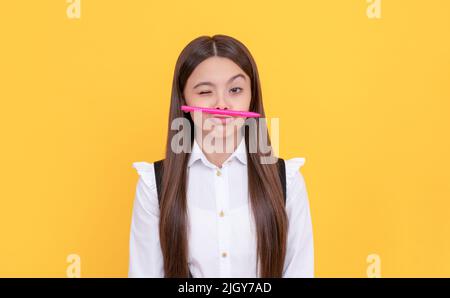 Knowledge day. Winking girl hold pen as mustache. School education. Knowledge day. Learning fun Stock Photo