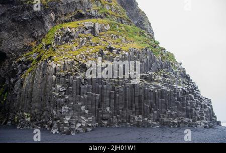 Reynisfjara is a world-famous black-sand beach on the South Coast of Iceland, just beside the small fishing village of Vík í Mýrdal. Stock Photo