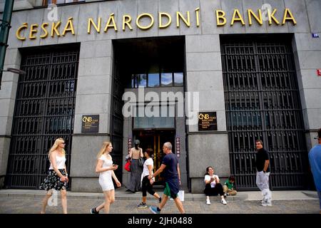 Prague, Czech Republic. 13th July, 2022. People walk past the Czech National Bank in Prague, Czech Republic, on July 13, 2022. Inflation in the Czech Republic measured by the increase in the consumer price index amounted to 17.2 percent year-on-year in June, up from 16 percent the previous month, according to data published by the Czech Statistical Office (CZSO) on Wednesday. Credit: Dana Kesnerova/Xinhua/Alamy Live News Stock Photo