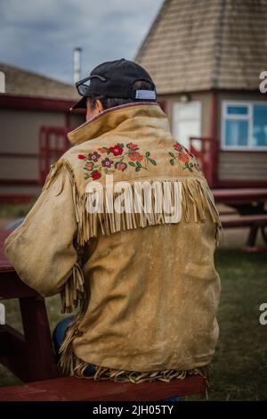 Indigenous Dene traditional tanned moosehide jacket, in the northern Indigenous community of Deline, Northwest Territories, Canada Stock Photo