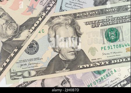 5, 20, 50, 100 dollars banknotes at different angles. Close up of dollars on white background. Stock Photo