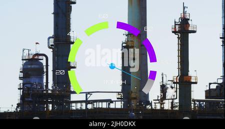Image of speedometer over refinery Stock Photo