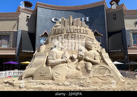 The 'Los Angeles: Home of Champions' sand sculpture at the Citadel Outlets, Friday, July 1, 2022, in the Commerce area of Los Angeles. The 20-foot tall, 36-feet wide, 350-ton sculpture recognizes the Super Bowl LVI champion Los Angeles Rams, MLB World Series champion Los Angeles Dodgers, NBA champion Los Angeles Lakers, NHL Stanley Cup champions LA Kings and  NCAA Champions USC Trojans and UCLA Bruins Stock Photo