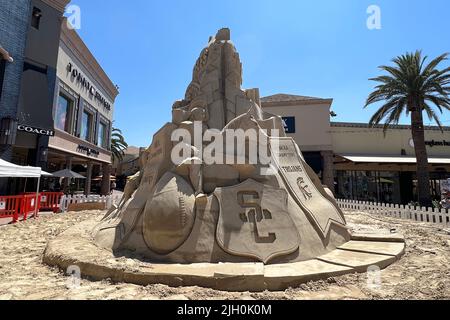 The 'Los Angeles: Home of Champions' sand sculpture at the Citadel Outlets, Friday, July 1, 2022, in the Commerce area of Los Angeles. The 20-foot tall, 36-feet wide, 350-ton sculpture recognizes the Super Bowl LVI champion Los Angeles Rams, MLB World Series champion Los Angeles Dodgers, NBA champion Los Angeles Lakers, NHL Stanley Cup champions LA Kings and  NCAA Champions USC Trojans and UCLA Bruins Stock Photo