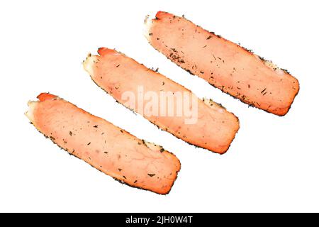 Three slices of Fillet Elena. Delicious, traditional Bulgarian dry cured pork loin with original spices, isolated on white background Stock Photo