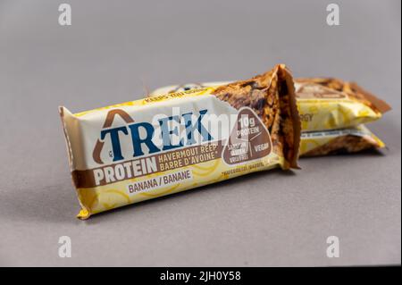 Three TREK Protein Energy Bars on Gray. A gluten-free, sugar-free snack. Products of the British company Natural Balance Foods. Healthy Foods. Ukraine Stock Photo