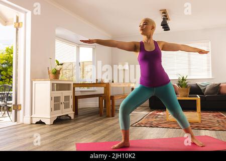 Woman and an exercise mat, corporate office background Stock Photo by rawf8