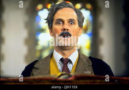 JOHN CLEESE, MONTY PYTHON'S THE MEANING OF LIFE, 1983 Stock Photo