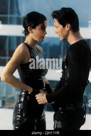 CARRIE-ANNE MOSS  KEANU REEVES, THE MATRIX, 1999 Stock Photo