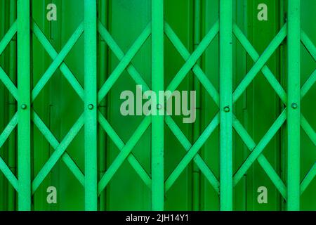 close up of green iron rolling shutter from shop in Thailand Stock Photo