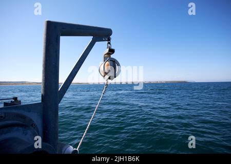 small fishing boat at sea off portrush on north coast of northern ireland Stock Photo