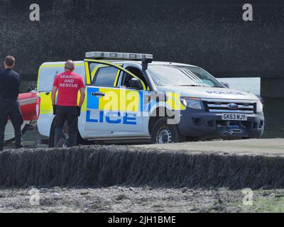 Iwade, Kent, UK. 14th July, 2022. Problems remain with Isle of Sheppey's water supply. Some residents are still without water nearly 3 days after the main water pipe supplying the island burst - although many in Sheerness & Minster were reconnected late last night. A long (reported to be 5km) fire hose is being used to pump water near the Sheppey Crossing to help resolve the problem (according to Kent Online) - but even this sprung a leak with water seen shooting high into the air (repaired by the time of these pics). Credit: James Bell/Alamy Live News Stock Photo