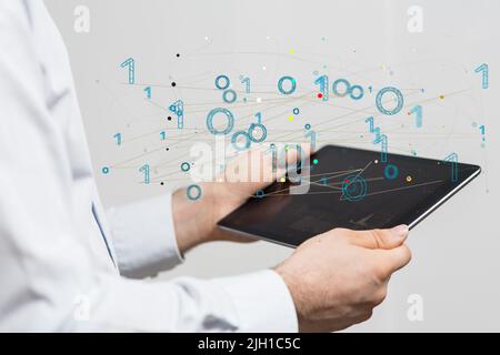 A person presenting a virtual projection of binary data Stock Photo