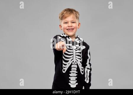 boy in costume of skeleton pointing to camera Stock Photo