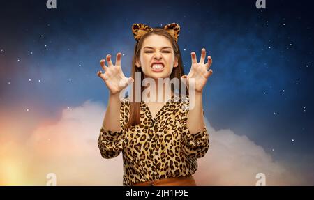 happy woman in halloween costume of leopard Stock Photo