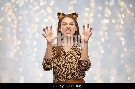 happy woman in halloween costume of leopard Stock Photo