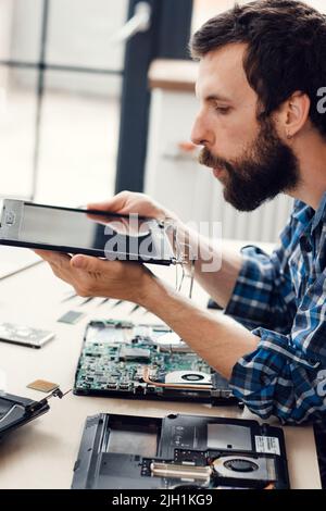 Engineer blow the dust off digital screen Stock Photo