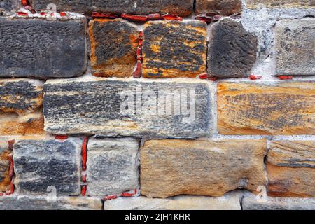 Limestone bricks background . Old stone wall texture Stock Photo