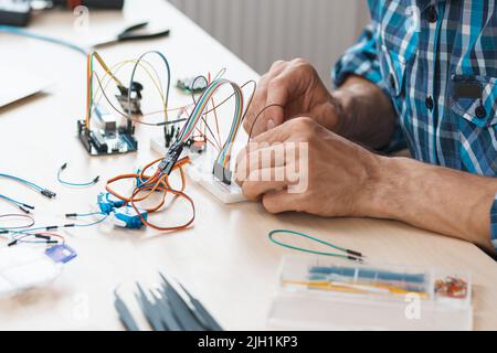 Breadboard with connected cables close-up. Stock Photo