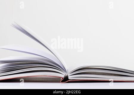 Layed Open Book Open book lying on a white background Stock Photo - Alamy