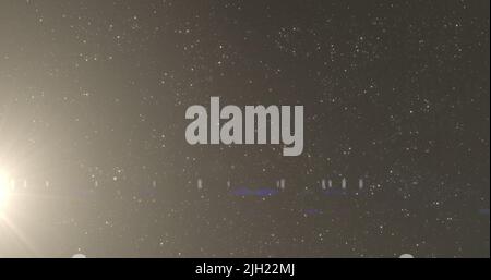 Image of light spots over black background Stock Photo