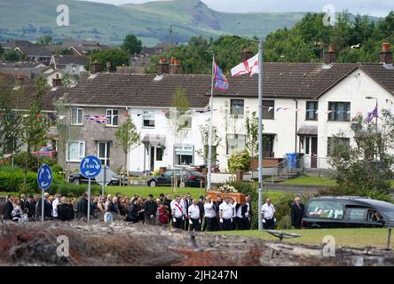 The coffin of John Steele is carried by mourners up Churchill Road, following his funeral service at his house in Larne, County Antrim. Picture date: Thursday July 14, 2022. Stock Photo