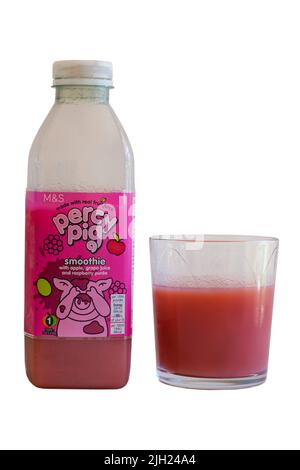 Bottle and glass of Percy Pig Smoothie with apple, grape juice and raspberry puree drink from M&S made with real fruit juice set on white background