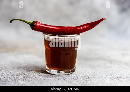 Close up of cup of coffee and pepper Stock Photo
