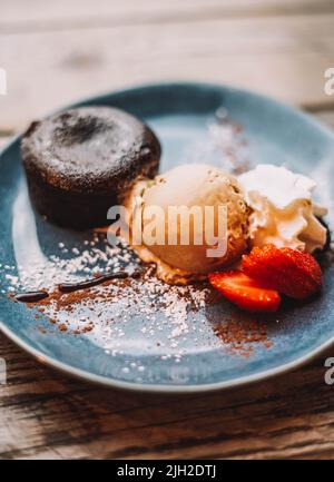 Chocolate coulant dessert with a scoop of ice cream Stock Photo