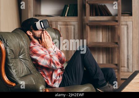 Excited man watching video in vr glasses Stock Photo