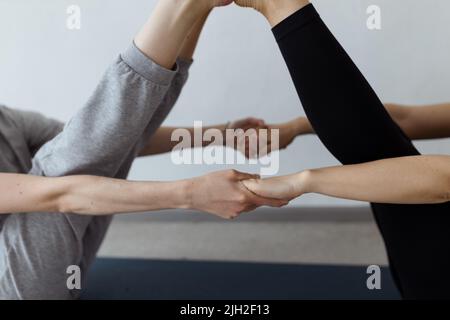 sporty yogi sisters doing fitness training. pair, couple yoga Stock Photo