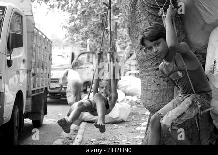 Strand Road, Kolkata, West Bengal, India. Date 29th May 2022. A CHILDHOOD WITH NO COLORFUL PLUGINS Stock Photo