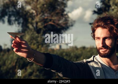 Profile of man aim with paper airplane free space Stock Photo