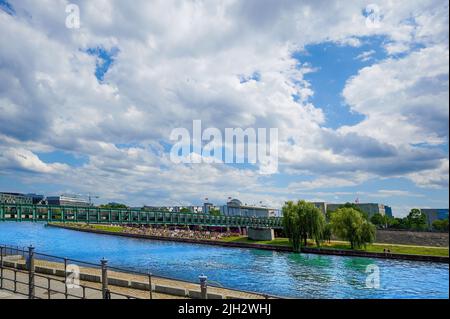 Berlin, Germany - July 29, 2021: View to a promenade of the river Spree in the government district of Berlin, Germany. Stock Photo