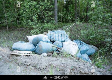 Garbage and pollution. Environmental protection or volunteering for charity, Waste disposal through recycling. Waste is densely deposited in the Stock Photo