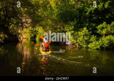 Pair of kayakers are kayaking together on their routine Stock Photo