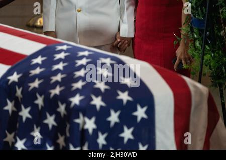 Washington DC, USA. 14th July, 2022. Britt Slabinski (L), a retired US Navy Seal and Medal of Honor recipient, and a woman hold hands as they pay their respects to Marine Chief Warrant Officer 4 Hershel Woodrow “Woody” Williams, the last surviving World War II Medal of Honor recipient, whose casket lies in honor in the Rotunda of the US Capitol, in Washington, DC, USA, 14 July 2022. The Marine Corps veteran, who died June 29th, was awarded the nation's highest award for his actions on Iwo Jima. (Photo by Pool/Sipa USA) Credit: Sipa USA/Alamy Live News Stock Photo