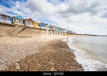 Colourful beach huts seen from the beach at Southwold on the Suffolk coast in July 2022. Stock Photo