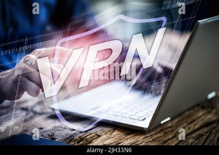 Lady Downloading VPN App On Laptop Computer Stock Photo