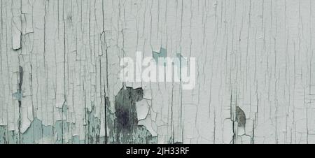 Old white scratched weathered white painted wood wall texture background. Old solid wood peeled slats rustic shabby surface background Stock Photo