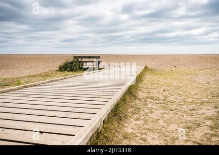 Boardwalk down to the shingle on Thorpeness beach on the Suffolk coastline. Stock Photo