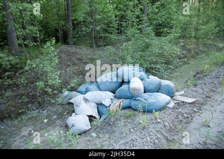 Garbage and pollution. Environmental protection or volunteering for charity, Waste disposal through recycling. Waste is densely deposited in the Stock Photo