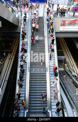 Berlin, Germany, July 5, 2022, escalators in the central station with many travelers Stock Photo