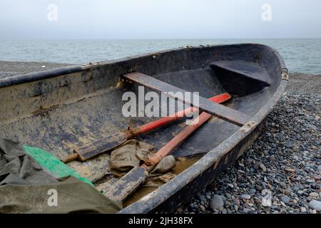 Old boat for fishing on the lake, quiet surface of water Stock Photo