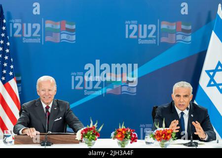 Jerusalem, Israel. 14th July, 2022. U.S President Joe Biden, and Israeli Prime Minister Yair Lapid, right, during a signing ceremony for the US-Israel Strategic Partnership agreement at the Waldorf Astoria, July 14, 2022 in Jerusalem, Israel. Credit: Adam Schultz/White House Photo/Alamy Live News Stock Photo